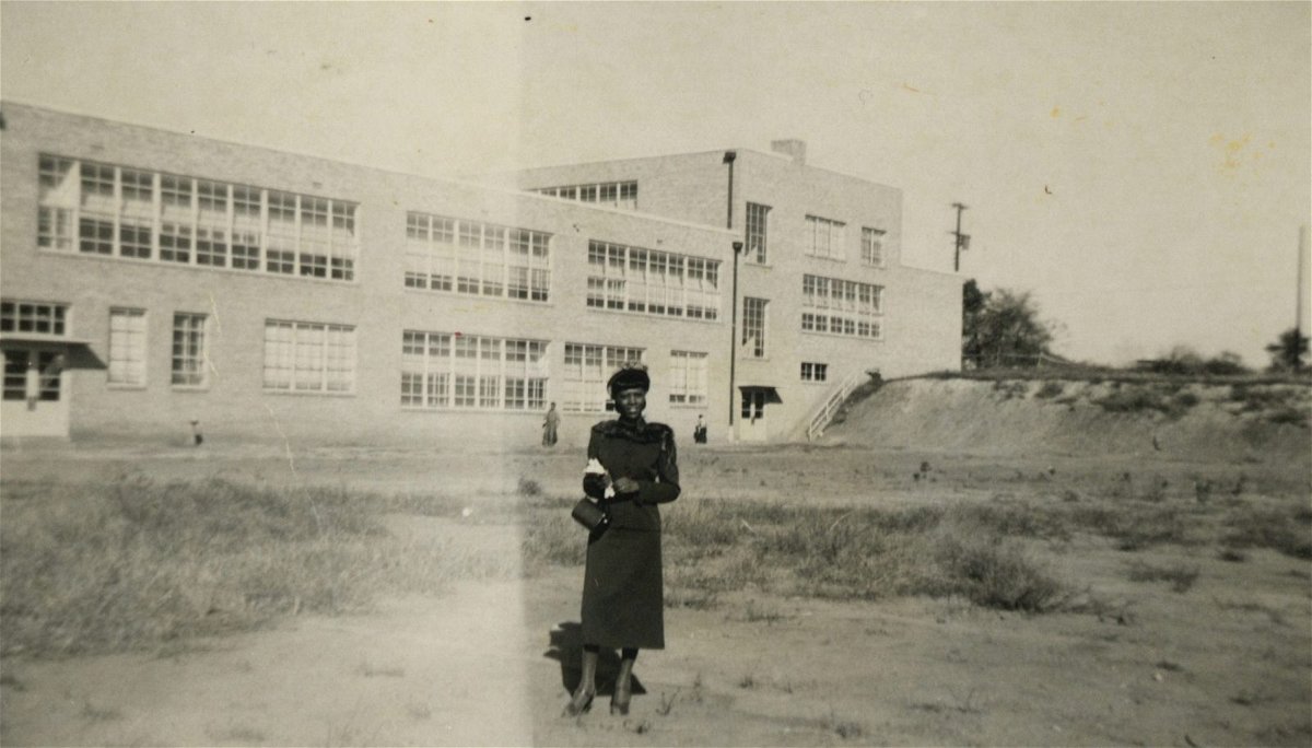 English and French teacher stands in front of Lincoln High School in 1939. Anderson was among the school's first faculty. 